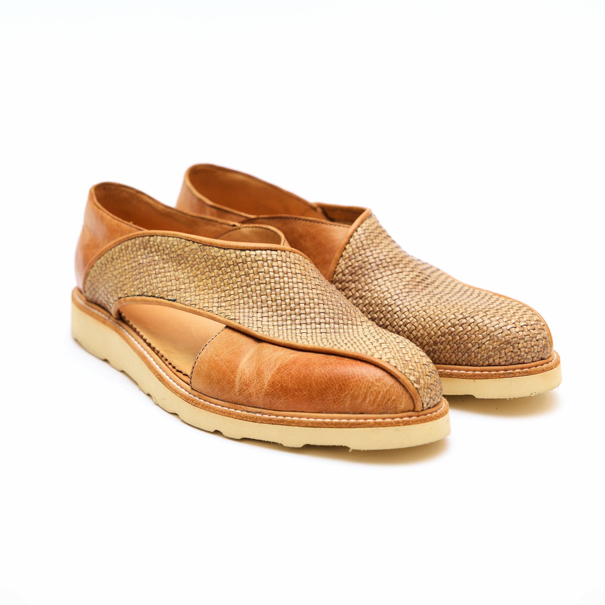 Tan leather Italian dress sandals with woven detailing. 