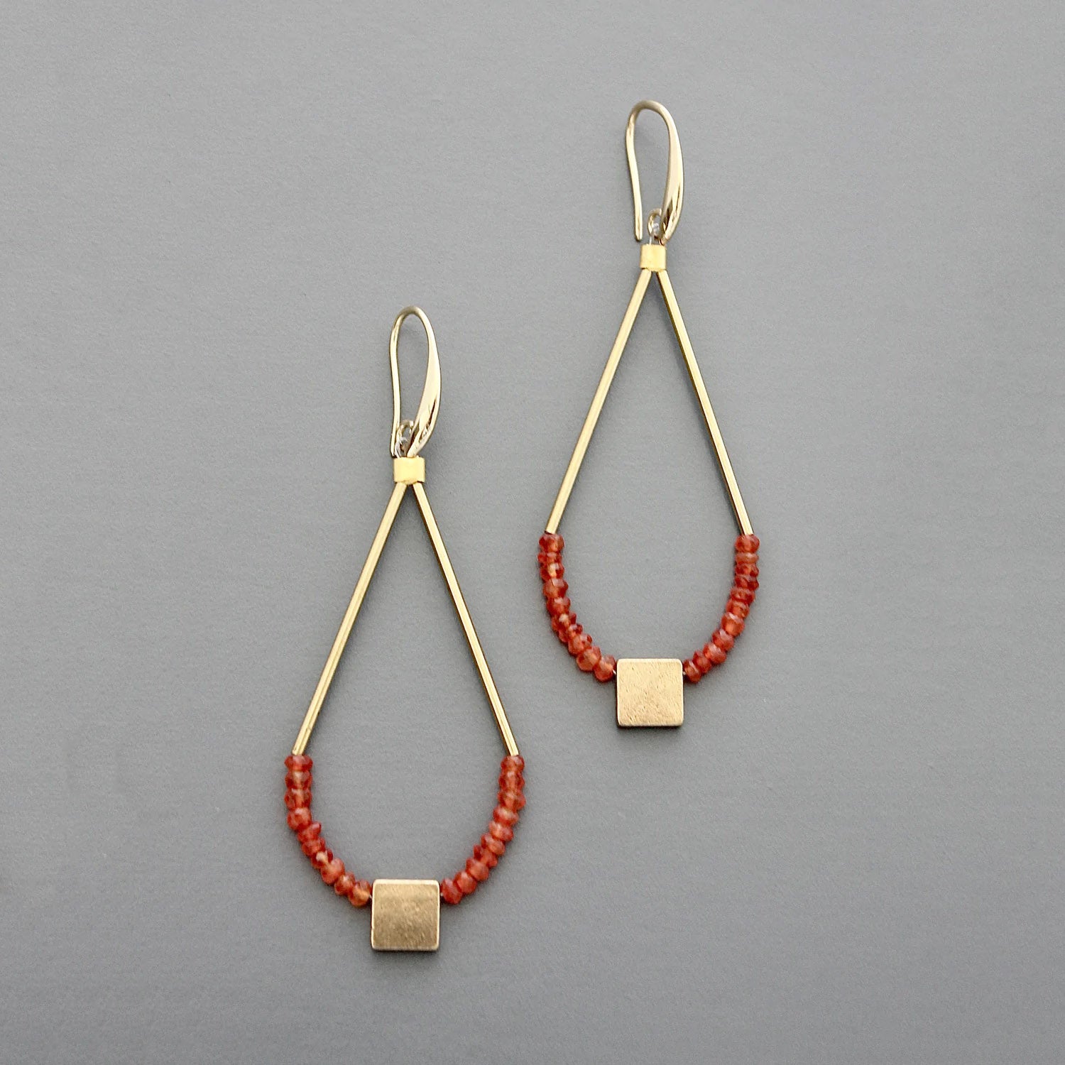 Gold plated brass earrings with tiny faceted carnelian beads and brass drops