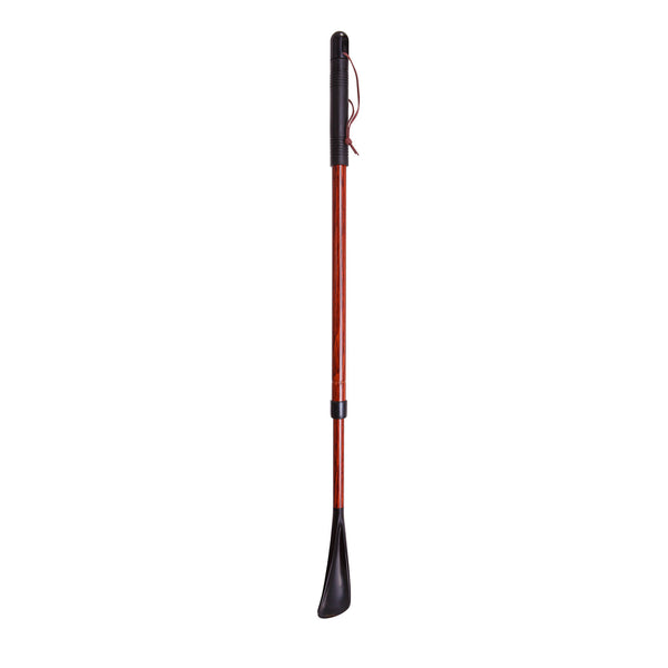 A long wooden adjustable shoe horn by Harvey Canes against white background. 