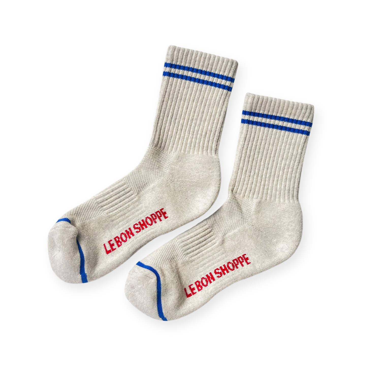 Pair of heather grey ribbed sport socks with double bleu stripe around ankle and "Le Bon Shoppe" on soul. 