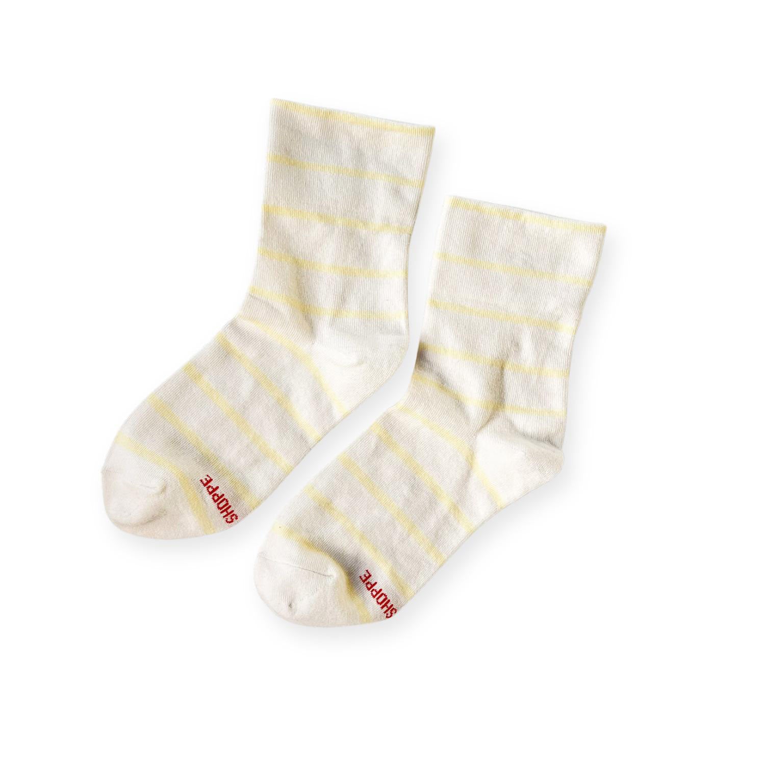 Pair of white with lemon yellow stripe socks with Shoppe print on toe. 
