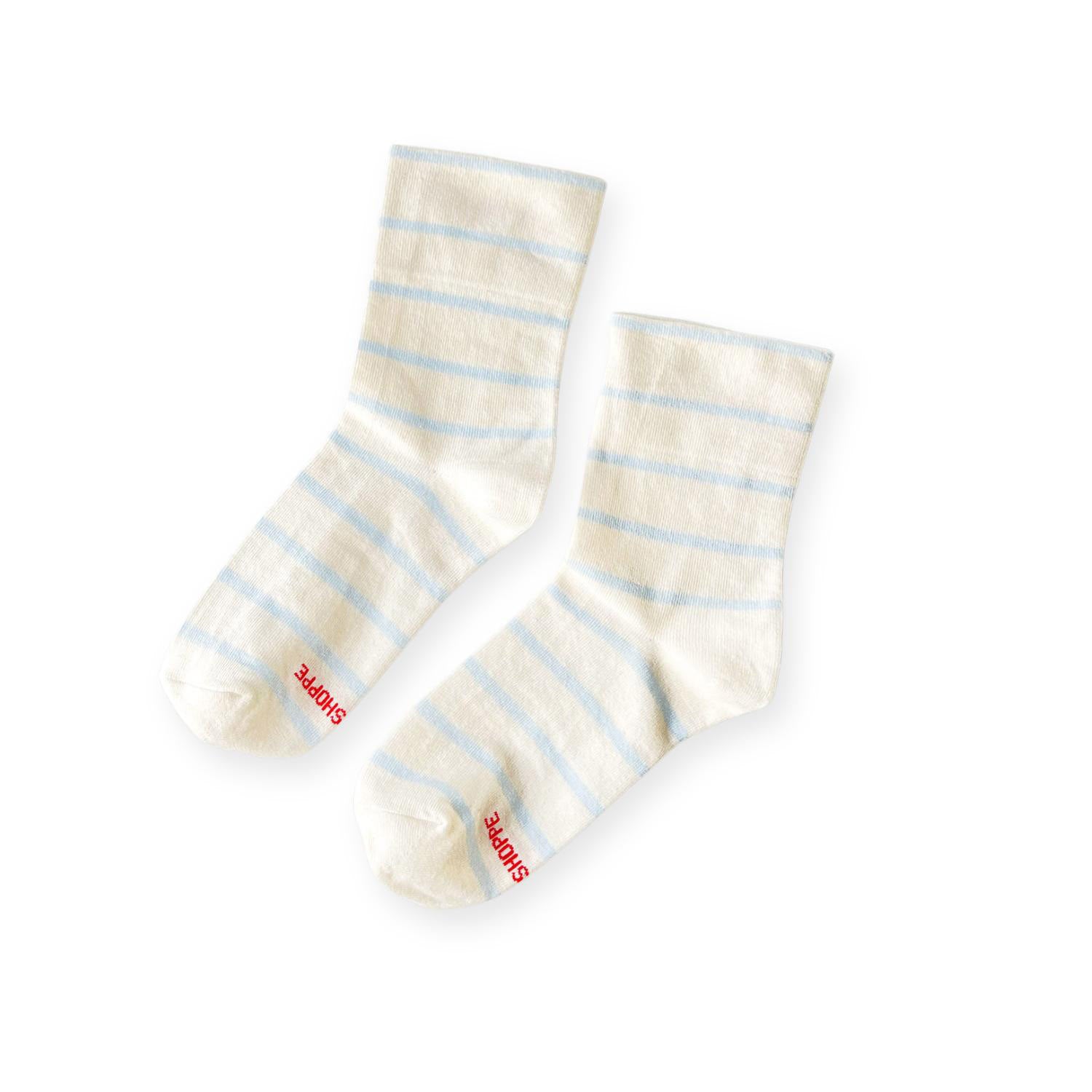 Pair of white with sky blue stripe socks with Shoppe print on toe. 