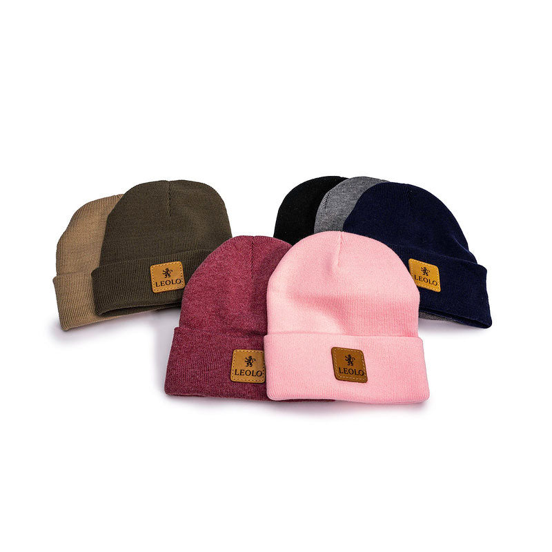 Seven beanies with leather "Leolo" logos - tan, olive, pink, red, black, grey and navy. 