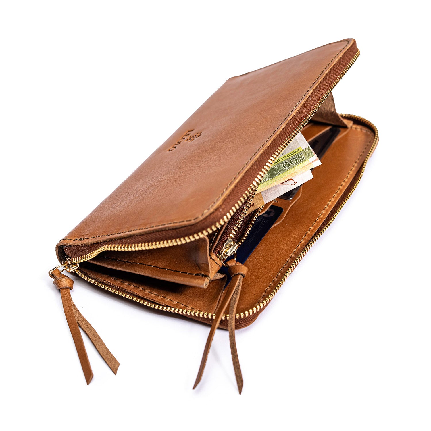 Tan leather Leolo zip around wallet, on a white background, open with money inside. 