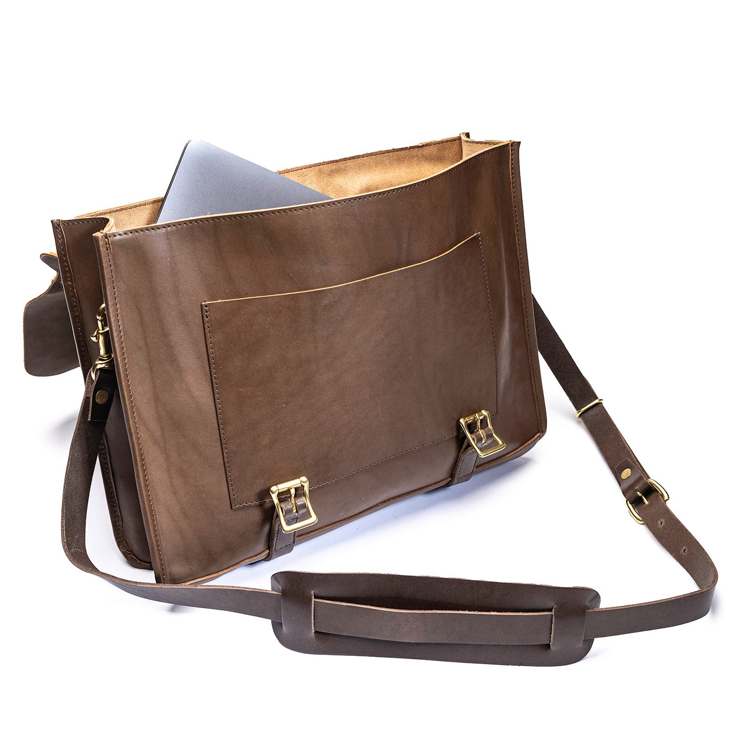 Brown leather Leolo messenger bag with outer flap open and laptop inside. 