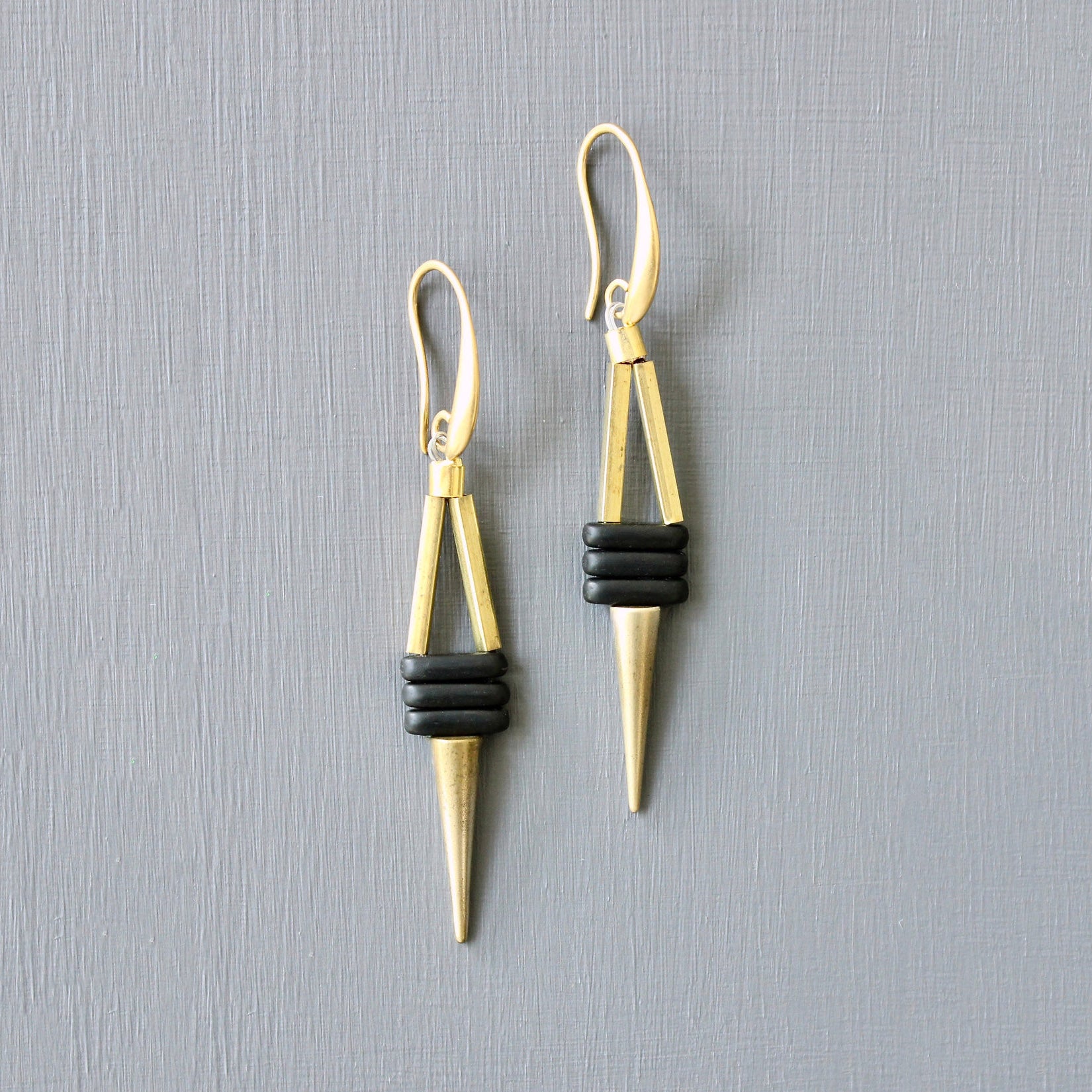 Brass plated black bead and spike earrings. 