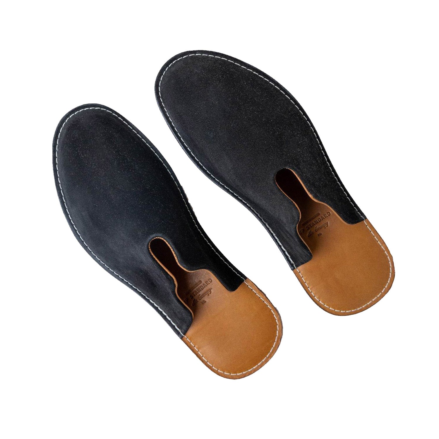 A pair of black Mr. Grumpy suede slippers by WP Standards. 